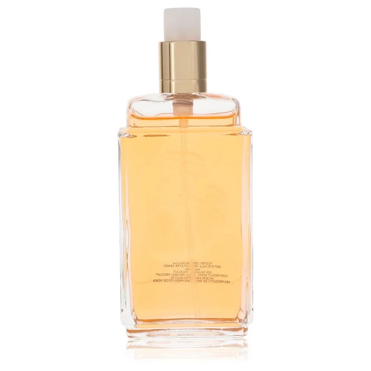 Clear glass bottle with gold cap on a white background
